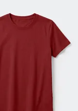 Remera básica de corte entallado, con cuello redondo y mangas cortas, confeccionada en tejido de algodón liso.