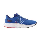 Championes de running New Balance Fresh Foam X EVOZ v3, color azul con detalles en blanco y rojo.