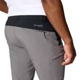 Pantalón gris Columbia modelo Triple Canyon P Ii, con tecnología Omni-Shade y Omni-Shield, diseñado para senderismo. Cuenta con bolsillos con cremallera y puños ajustables.