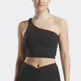 Top deportivo Reebok Lux de yoga, color negro, con un solo tirante asimétrico. Confeccionado con tejido RBK-DRY que absorbe el sudor.