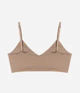 Soutien tipo bralette confeccionado en poliamida sin costuras, con escote en V, breteles finos ajustables y copas desmontables.