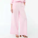Pantalón palazzo de lino mezclado color rosa, de tiro alto con cintura elástica y corte amplio y fluido en las piernas.