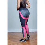 Calza deportiva de tiro alto con diseño color block en azul marino y fucsia, presentando un patrón hexagonal en la parte inferior de las piernas.