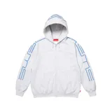 Campera Supreme con capucha y cierre frontal completo, modelo Connect en color gris jaspeado con detalles bordados en relieve de color celeste en las mangas y la capucha. Cuenta con bolsillos tipo canguro en la parte delantera.