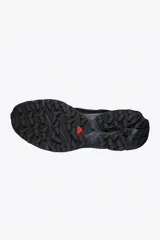 Championes Salomon modelo XT-4, diseñados para trail running, en color negro con detalles técnicos en la estructura y suela de alto agarre.