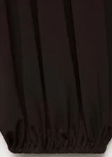 Pantalón de estilo globo color marrón, de tiro medio con panel elástico en la cintura y tejido elástico.