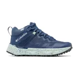 Bota de senderismo Columbia Facet 75 Mid Outdry, color azul oscuro con entresuela moteada en tono celeste. Presenta diseño de media caña con tecnología impermeable, soporte de TPU en el mediopié y suela con tracción avanzada.