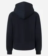 Campera deportiva de corte regular, color beige, con capucha ajustable mediante cordones, cierre frontal de cremallera y bolsillos laterales. Confeccionada en tejido de algodón y poliéster.