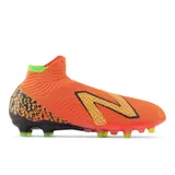 Championes de fútbol New Balance Tekela v4 Pro FG, color naranja con detalles en negro, amarillo y verde.