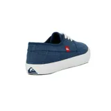 Zapatillas Quiksilver modelo New Port para hombre, color azul marino de efecto denim, con cordones blancos, suela de goma blanca y etiqueta roja con el logo de la marca en el lateral.