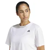 Remera deportiva Adidas de mujer, modelo We Min Tee, en color blanco, de corte corto (crop), manga corta y cuello redondo, con el logo de la marca estampado en negro en el pecho.
