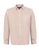 Camisa de lino de manga larga en color beige, con cuello camisero, cierre frontal de botones y un bolsillo aplicado en el pecho.