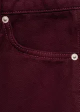 Jeans de tiro alto y estilo barrel con diseño balloon, cinco bolsillos, trabillas y cierre frontal de botón y cremallera.