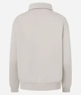 Saco cerrado de algodón con felpa, color bordó, con cuello polo, cierre frontal con botones, manga larga y puños y bajo ajustados.