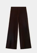 Pantalón wide leg de terciopelo marrón, de tiro medio con cintura elástica sin cierre y diseño largo fluido.
