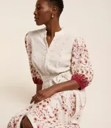 Vestido chemise midi de viscolino con estampado floral, manga abullonada 3/4 y lazo delantero.