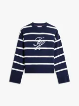 Sweater amplio de punto Tommy Hilfiger confeccionado en puro algodón peinado, de diseño a rayas horizontales azul marino y blancas, con cuello redondo y hombros caídos. Presenta el logo bordado en fuente Script en la parte delantera.