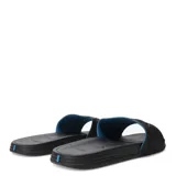 Sandalias tipo slide Rider, color negro con detalle interior en azul. Presentan una banda ancha con textura acanalada y el logo de la marca en relieve.