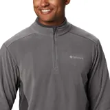 Buzo polar de media cremallera Columbia, confeccionado en tejido suave con protección solar UPF 50. Presenta cuello alto, mangas largas y paneles laterales en un tono de gris más oscuro.