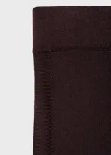 Pantalón wideleg de punto fino y tiro medio, con cintura elástica sin cierre, diseño largo y corte holgado.