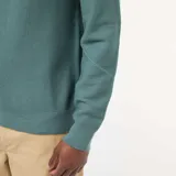 Sweater de punto fino con cuello redondo, manga larga y puños acanalados, de diseño liso y corte estándar.