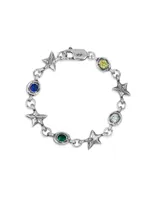 Pulsera de eslabones plateados con dijes alternados de estrellas texturizadas y piedras preciosas engarzadas en engaste irregular. Las piedras visibles son de color azul oscuro, amarillo, verde esmeralda y celeste/blanco.
