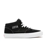 Championes de skate Vans Half Cab, color negro con detalles en blanco. Diseño de media caña con refuerzos DURACAP, plantilla POPCUSH y suela vulcanizada WaffleGrip.