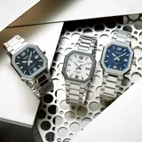 Reloj analógico Casio con caja octagonal de acero inoxidable, esfera azul con textura y malla de eslabones plateada. Cuenta con indicador de fecha y movimiento de cuarzo.