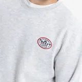Buzo de cuello redondo color gris melange, con diseño de calce holgado y logo circular de la marca Reef estampado en el pecho.