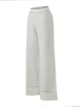 Pantalón recto de tiro alto RKF modelo Mekong, color verde claro, confeccionado en lino orgánico y viscosa. Presenta un diseño con detalles de calados geométricos en la pretina y en los dobladillos.