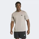 Remera Adidas Workout Essentials Feelready de color gris melange, con diseño clásico de manga corta y cuello redondo. Cuenta con el logo de la marca estampado en el pecho en color negro y tecnología de absorción de humedad.