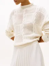 Falda midi plisada de poliéster color blanco, con cintura elástica con logo de la marca.