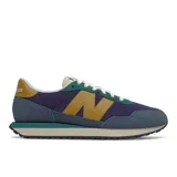Championes New Balance 237 de hombre, con capellada de gamuza y tela de color azul, verde y mostaza.