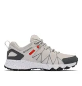 Championes de senderismo Columbia modelo Peakfreak II OutDry, color beige con detalles en gris oscuro y acentos en naranja. Presentan una estructura de malla técnica con refuerzos impresos en 3D, tecnología impermeable OutDry, sistema de ajuste Navic Fit y entresuela TechLite+ con diseño moteado. La suela Adapt Trax ofrece tracción superior en diversos terrenos.