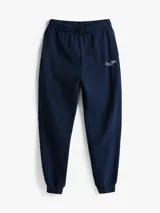 Pantalón de jogging azul marino de algodón con cintura y tobillos elastizados y logo bordado en blanco.