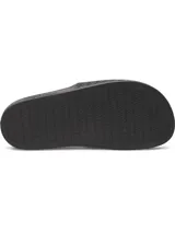Chancletas Under Armour UA W Armr Slide Lite color negro, de EVA moldeada de una sola pieza, con tira ancha texturizada y el logo de la marca en blanco.