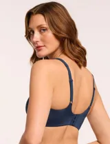 Bralette de diseño minimalista y acabado invisible, sin aros, con copas removibles y tiras regulables. Presenta una silueta suave y cómoda para el uso diario.