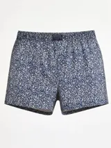 Bóxer de algodón liviano, color azul marino, con estampado floral en blanco y cintura elastizada.