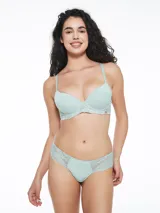 Colaless de lycra color verde claro con detalle de encaje floral en los laterales.