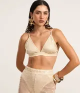 Top cropped femenino con escote en V, breteles finos ajustables y tejido cubierto de lentejuelas.