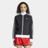 Campera deportiva Adidas Originals, modelo clásico Adicolor Firebird, de color negro con detalles en blanco. Presenta cierre frontal completo, cuello alto tipo embudo, bolsillos laterales con cierre y las icónicas tres tiras blancas en las mangas. El logo del trifolio de Adidas está bordado en el pecho.
