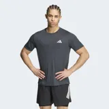 Remera deportiva Adidas Adi365 Essentials de color gris oscuro, con cuello redondo y mangas cortas. Incorpora tecnología Climacool y logo reflectante de la marca en el pecho.