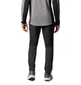 Pantalón Columbia Three Pitch Pant de color negro, diseñado para senderismo, con tecnología Omni-Shade UPF 50 y Omni-Shield que repele la humedad. Cuenta con cintura elástica con cordón interior, bolsillos para objetos pequeños, bolsillo de seguridad con cremallera, rodillas articuladas, cremalleras en las piernas y detalles reflectantes.