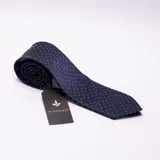 Corbata azul marino con lunares blancos, confeccionada en microfibra.