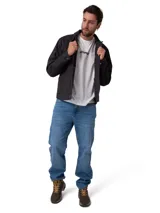 Chaqueta de canvas color negro con forro de franela cepillada. Presenta cierre frontal con botones, bolsillos en el pecho con solapa y bolsillos laterales. Incluye etiqueta de marca Caterpillar en el bolsillo inferior.