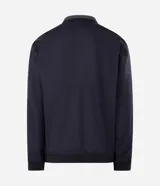 Campera deportiva reversible de manga larga con cierre frontal de cremallera, cuello alto y bolsillos laterales. Confeccionada en poliamida con forro interior de fleece, presenta un pequeño logo estampado en el pecho.