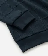 Buzo de cuello redondo y manga larga, confeccionado en tejido de poliéster con textura de cuerdas en relieve y puños acanalados.