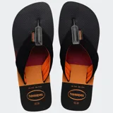 Ojotas Havaianas Urban Print con base verde militar y verde neón, tiras anchas bicolores con logo de la marca.