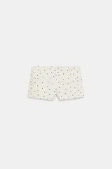 Shorts mini de tiro medio con estampado de lunares, corte ajustado y cierre lateral con cremallera.