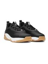 Championes de entrenamiento Under Armour Project Rock 8, color negro con entresuela blanca y suela de goma color caramelo. Presentan una parte superior de malla técnica con detalles en gamuza, lengüeta de neopreno perforada y contrafuerte externo en el talón para mayor estabilidad. Incorporan tecnología de amortiguación UA HOVR y suela UA TriBase para maximizar el contacto con el suelo y brindar flexibilidad.